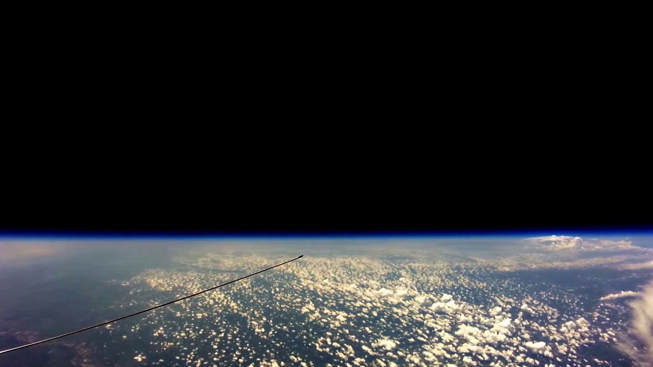High-altitude amateur balloon footage showing a wide, flat horizon at very high altitude.
