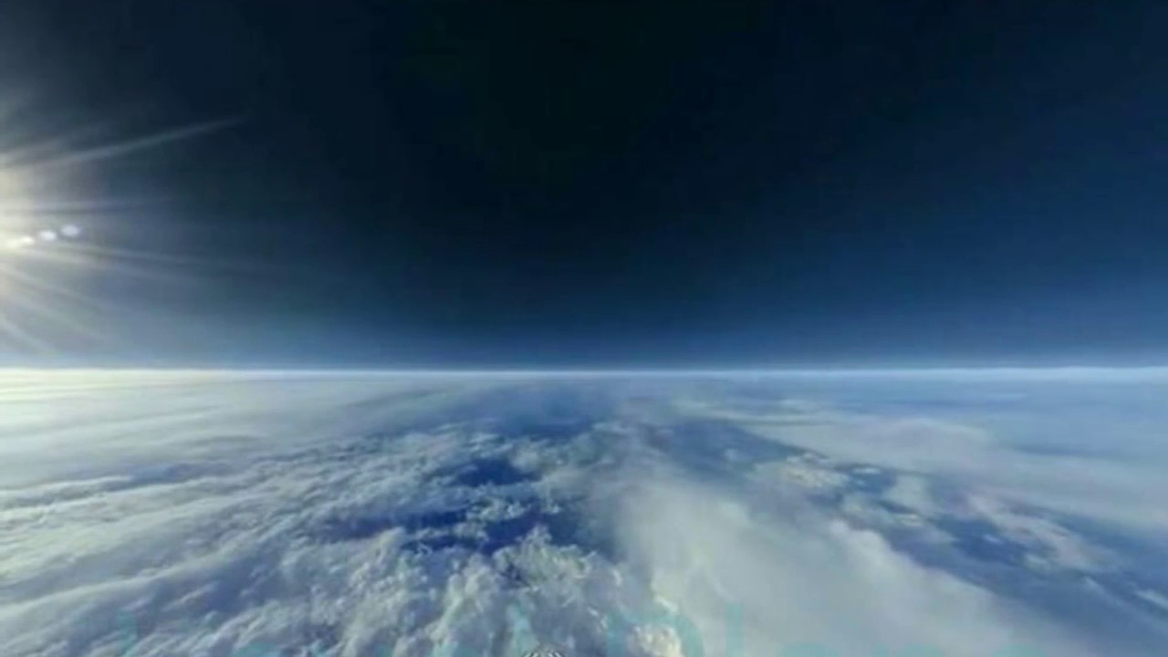 High-altitude balloon footage showing a flat horizon above the layered atmosphere.