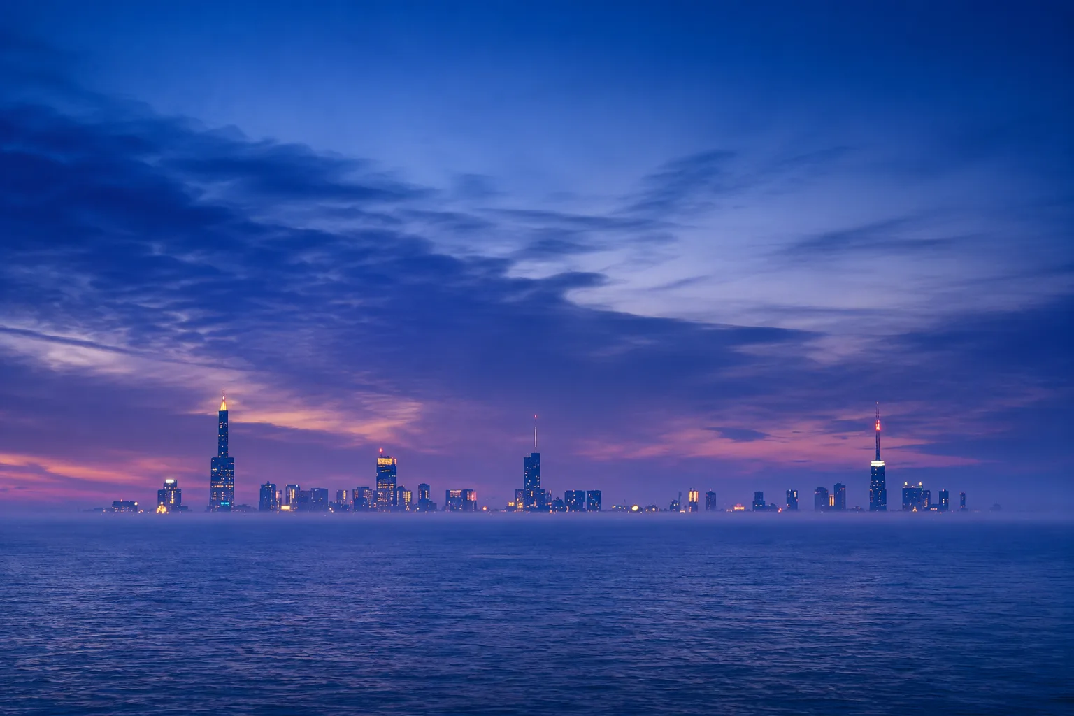 The full Chicago skyline photographed across roughly sixty miles of Lake Michigan, visible at full height where the globe model requires it hidden behind some 2,400 feet of curvature.